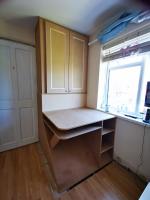 Desk and storage area of childs bedroom