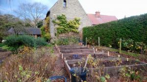 Forming raised vegetable beds using salvaged sleepers