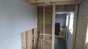 Studwork being formed to split one bathroom into two