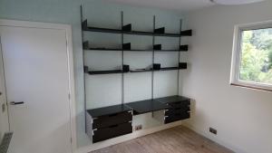 Home office formed with flush doorway, feature radiator, electrics, decorating and modular desk system