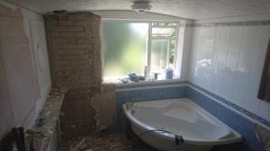bathroom being stripped for conversion into two separate ensuites